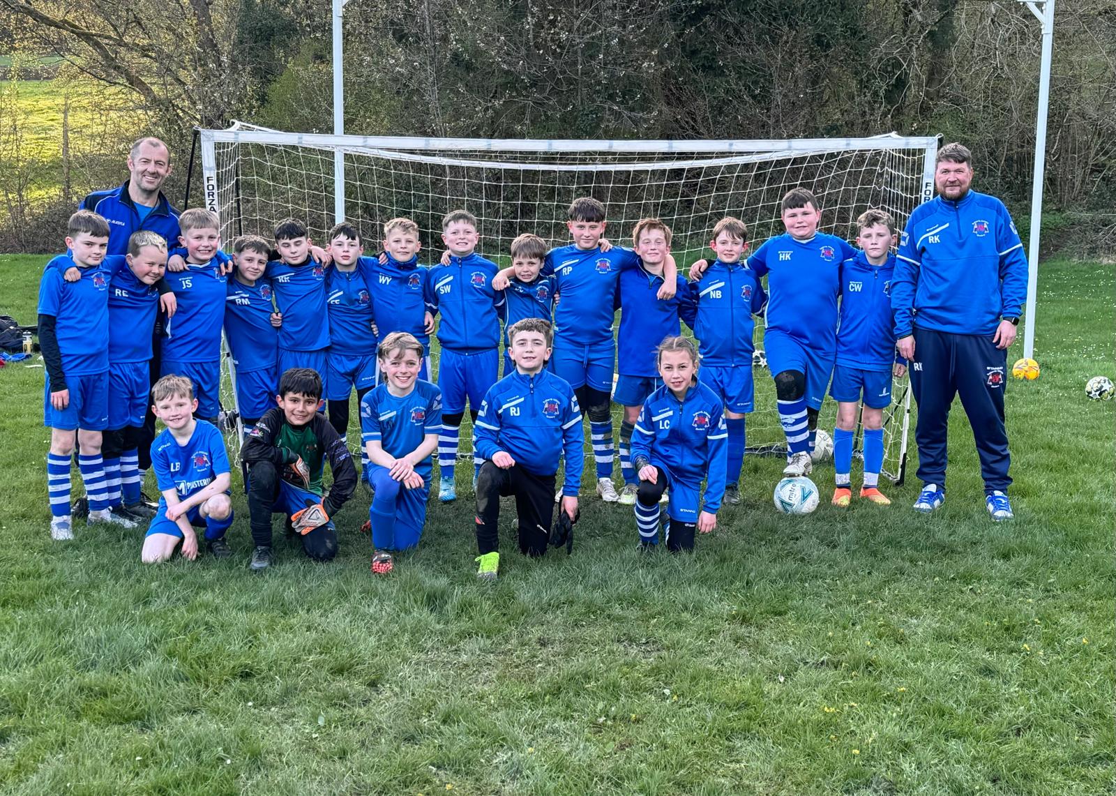 Children at Treharris Athletic Western Under 10’s football club receive new football kits thanks to Credit Union sponsorship