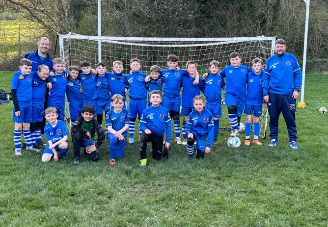 Children at Treharris Athletic Western Under 10’s football club receive new football kits thanks to Credit Union sponsorship